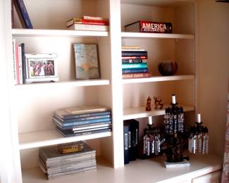 Books and antique three tiered brass lamp with prisms