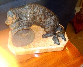 Heavy metal dog figurine on marble base