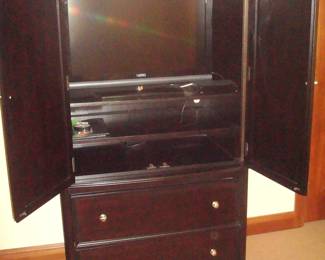 Armoire opened with television 