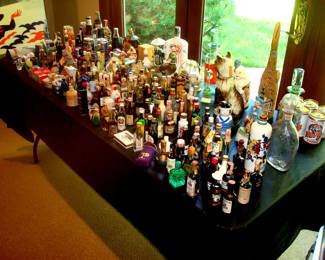 large collection bottles, decanters & beer cans.