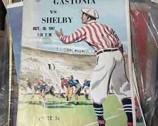 Several vintage football programs