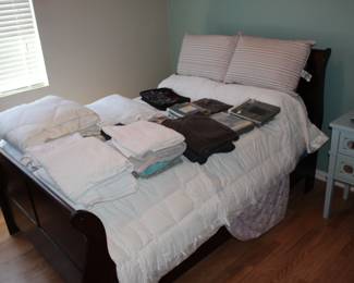 Sleigh bed with like new mattress and box spring still in plastic