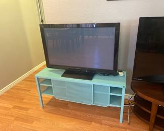 Flat Screen TV by Panasonic on metal tv stand