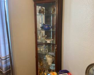 Glass curio cabinet with lighting