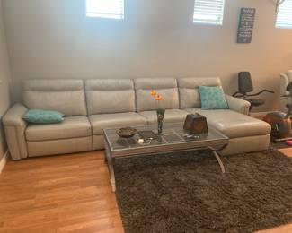 Like new Leather sectional, gray shaggy rug, contemporary coffee table