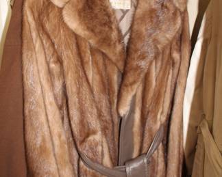 Fur jacket with leather belt