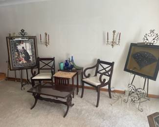 framed art, mahogany furniture and several easels throughout the home