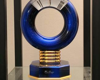 HOUR LAVIGNE, PARIS SCULPTURAL CLOCK WITH "MYSTERY" ANNULAR DISPLAY  A SHOWPIECE OF ARTISTRY, AESTHETICS & OLD WORLD CRAFTSMANSHIP

This remarkable timepiece with glowing gem-like pyrite flecked lapis lazui enamel finish, gold plated oval ring pedestal and plinth qualifies as the ultimate Hour Lavigne luxury model.  Original retail price during the late 1980s exceeded $2,500.  I've not encountered another example in a career spanning fifty years; first in clock restoration and sales, followed by 42 years as a professional appraiser of antiques, decorative and fine art.   Bold Roman numerals and 15-minute markers travel clockwise.  Time is read through a thick magnifying crystal with gold center line.   The clock is in flawless "as new" condition.  It displays impressively on a mantle, desk or side table.  $929

8.25" high, 5.75" diameter torus, 4" deep at base
weight 6.6 lbs!

       




