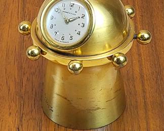 RARE 1960 French Gilt-Bronze Mini Capstan Clock by Andre Wyler 15-jewel movement.   The capstan swivels smoothly 360 degrees on a massive cast bronze pedestal.  The domical case with hollow cavity is precisely machined to hold the watch, with a cutout for the stem and crown.  The 15-jewel lever movement can be wound in situ.   An engraved presentation spanning almost half of the pedestal provides a unique "lost in time" provenance.  "Charting our course for 1960  Full speed ahead - The time is right Semper Fi"             
Engraving on the base personalizes the luxury gift - "To Mary T and Ed - from Sally and Larry"  3.1 high to crest of the crown, 2.75" wheel diameter
weighs an impressive 1.5 lbs. -- papers under this clock won't fly away!  $395