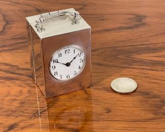 Early 20th century sterling silver cased sub-miniature carriage clock.  Fine fired enamel dial, high grade French  8-day movement  $795