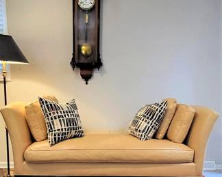 Classic Barbara Barry for Baker Furniture chaise down-filled leather java hardwood.  Contemporary style by the highly regarded interior designer collaborating with the oldest prestige manufacturer of American furniture. 

This statement piece conveys elegance through clean lines, generous size, fine proportions, down-filled luxury leather, reeded java hardwood skirt and square tapered legs.

The 6' 5" long x 3' deep chaise is completely finished - ideal for a large room divider or in place of a bed.
Maintained in very good condition.  Sole damage limited to abrasions at two outside top end corners.

NOTE:  Prior to transport, the chaise with be professionally cleaned and treated with leather conditioner.  Skirt and legs will be polished with dark brown British Briwax.   $1,895