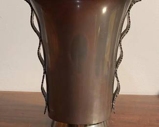 ICONIC FRENCH ART DECO DINANDERIE PEWTER VASE DESIGNED & HANDWROUGHT BY RENE DELAVAN  $415


Refined proportions, form and handle treatment of this marvelous vase reflect respected dinanderier Rene Delavan's expression of the movement introduced in 1925 at Exposition Internationale des Arts Décoratifs et Industriels Modernes.   

Base stamped with circular trademark of Delavan, Paris above "ETAIN D'ARTE."

Provenance:  Kelly Gallery, New York

6.5" (16.5cm) high, 5.7" (14.6cm) wide at top of handles, 2.9" (7.4cm) diameter foot  1.16 lbs.


