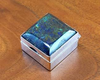 Handsome Handcrafted 1960s Taxco Sterling Silver & Azurite Sub-miniature Pill Box  $74    In the world of handcrafted silver boxes, the smaller, the more challenging to fabricate.  This elegant example is a beauty.  The top is mounted with a polished and beveled azurite specimen of vibrant colors.  An arch-shape cutout facilitates opening.  The underside is stamped with the eagle 3 mark (designating Taxco), "sterling" "925" "Taxco" and maker's initials.
0.54" high, 0.83" wide, 0.91" deep