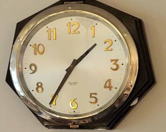 Circa 1940 octagonal Bakelite and chrome 8-day wall clock by Bayard, France.  Original throughout.  9.5" wide.  Operating order.   $325