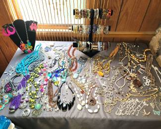 Hundreds of bracelets, necklaces, earrings (pierced and clip)