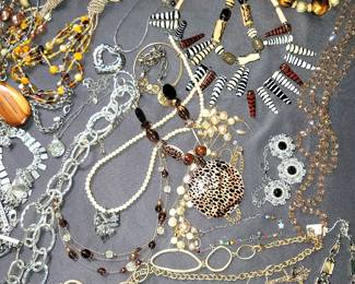 Hundreds of bracelets, necklaces, earrings (pierced and clip)