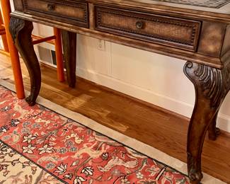 Beautifully carved sofa table with carved inlay and two drawers.