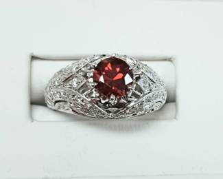 All diamond setting with a beautiful red spinel stone in white gold