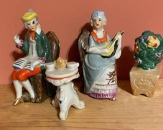 Set off 4 collectible porcelains: colonial man, woman, table, & planter.  All marked "made in Japan" and dated "1938" by recipient