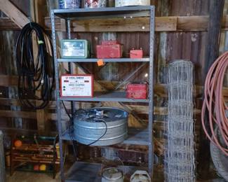 chicken incubator, watering cans, wire roll and gas cans