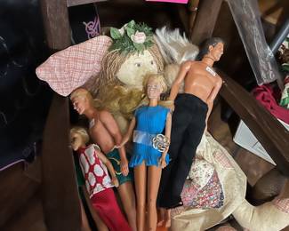 Barbie dolls and a bag of clothes