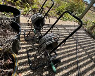 A pair of water hose reels w/ hose