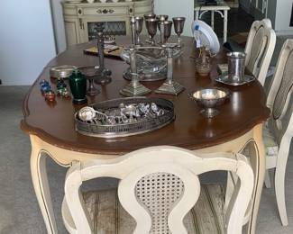 The dining room table set with some of the silver 