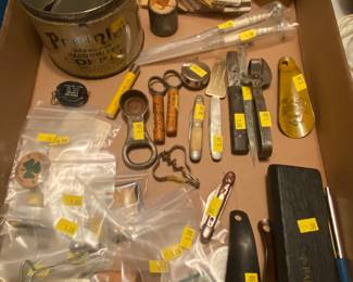 Lots of vintage cool paper, advertising, fishing licenses, dog tags