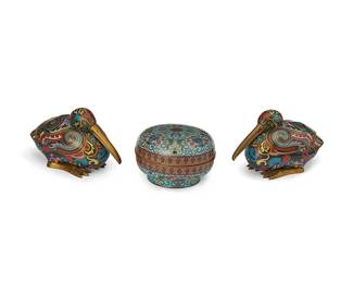 1028
20th century
A Group Of Chinese Covered Cloisonné Boxes
Each appears unmarked
Wach brass box rendered in colorful enamels on blue ground, comprising a round box and pair of lidded containers in the form of long-beaked water fowl, 3 pieces
Larger: 4" H x 2.75" x 8" D; smaller: 3" H x 4.5" Dia.
Estimate: $500 - $700