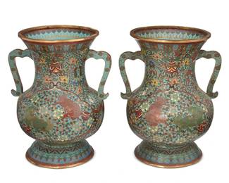 1036
Late 19th century or later
A Pair Of East Asian Cloisonné Handled Urns
Each brass baluster vase with all-over polychrome enameled lotus scroll and mythical beast motifs and opposing curved handles; the underside of each with a single East Asian character reading fu/fuku, 2 pieces
Each: 14" H x 10.5" Dia.
Estimate: $700 - $900