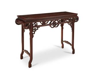 1038
20th Century
A Chinese Carved Wood Altar Table
The altar table of Pingtou'an form with openwork apron depicting scrolled, meandering, and cash-medallion motifs, set upon four legs with carved wood stretchers
36.25" H x 53" W x 17.25" D
Estimate: $500 - $700