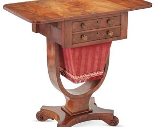 1046
19th century
An English Regency-Style Sewing Stand
With a drop leaf top over an upper drawer and a lower pull-out fabric basket on a concave platform base with scrolled feet
28.25" H x 17" W x 16.5" D
Estimate: $800 - $1,200