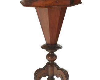 1047
19th century
A Victorian Walnut Octagonal Sewing Table
With a hinged, locking marquetry inlaid top, opening to reveal various silk-lined compartments to the interior, over a conformingly designed pedestal, set upon out-swept carved wood tripod legs
29.5" H x 17.5" Dia.
Estimate: $500 - $700