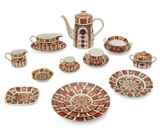 1054
1980s/90s
A Royal Crown Derby "Old Imari" Bone China Dinner Service
Each backstamped with various date marks and further marked: Royal Crown Derby / English Bone China / [logo with crown] / Old Imari / 1128
The dinner service decorated with blue, red, and gilt floral and geometric motifs, comprising: 9 dinner plates (10.625"), 6 Sheffield fluted dessert plates (8.75"), 9 salad plates (8.625"), 9 bread and butter plates (6.325"), 7 footed cream soup bowl (5"), 6 soup bowl saucers (6.5"), 1 gravy boat (8.125"), 1 gravy boat saucer (8.5"), 9 flat cup saucers (5.875"), 9 flat cups (3.325"), 6 demitasse saucers (4.5"), 6 demitasse cups (2.325"), 1 creamer (5"), 1 lidded sugar bowl (6"), 2 lidded coffee pots (10"), 2 Tudor Rose trays (4.5"), and 1 "1995" tray (6.5"), 85 pieces
Estimate: $1,000 - $1,500