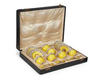 1056
Late 19th/early 20th century
A Set Of Royal Worcester Gilt Porcelain Cups
Each porcelain piece marked to the underside: Royal Worcester / Made in England; each spoon marked for 925; each spoon with various other assay and maker's marks
Comprising 6 yellow and gilt demitasse cups (2") with floral motif banding to the rim and 6 diminutive saucers (3.75" Dia.) with conforming decoration, along with 6 demitasse sterling silver and guilloche yellow enamel spoon (3.75"); accompanying satin-lined leather storage case, 19 pieces total
Case: 2.75" H x 13.75" W x 10.25" D
Estimate: $600 - $800