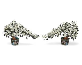 1065
Mid-20th century
Two Chinese Carved Stone Trees
Each unmarked
Each tree decorated with carved hardstone flowers and possibly nephrite leaves, affixed to woven fabric-encased and pliable "branches," stemming from a painted plaster trunk, set in a weighted metal and enamel cloisonné pot with floral and avian motifs, 2 pieces
Each: 20.5" H x 28" W x 13.5" D approximately
Estimate: $700 - $900