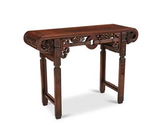 1067
Late 19th/early 20th century
A Chinese Carved Wood Altar Table
The altar table with openwork apron depicting eternal knot and cloud motifs, set upon four carved wood legs
33.5" H x 45.5" W x 16" D
Estimate: $800 - $1,200