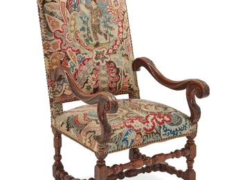 1070
19th century
A Louis XIII-Style Needlepoint Upholstered Walnut Armchair
Appears unmarked
The high-backed armchair with carved foliate walnut frame and gros and petit point upholstery on the front and red velvet upholstery on the back, the edges of each accented with brass tacking
47.25" H x 25" W x 25.75" D
Estimate: $600 - $800