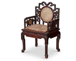 1080
Early 20th century
A Chinese Hardwood Armchair
The carved hardwood chair with openwork back splat and armrests inset with marble discs, over a rectangular cushion with floral upholstery and raised on four curvilinear legs
42.5" H x 27.75" W x 21.5" D
Estimate: $800 - $1,200