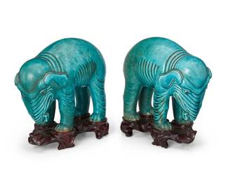 1081
Qing Dynasty 1644-1911 or later
A Pair Of Chinese Export Blue Glazed Porcelain Elephants
Each appears unmarked
Each with deep skin folds, heads turned to one side, and an all-over turquoise glaze; set upon a fitted carved wood stand, 2 pieces
Each with stand: 8.5" H x 3.5" W x 9" D
Estimate: $1,000 - $1,500