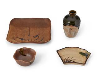 1084
Mid/late 20th century
A Group Of Japanese Oribe-Yaki Sake And Dinner Service Items
The group of earthenware studio pottery items comprising 1 drip-glazed wine server (5.125" H x 3.125" Dia.), 5 drip-glazed kobachi bowls (2" H x 3.75" W x 3.75" D), 5 medium plates (8" W x 8" D approx.), and 5 small plates (5.875" W x 4.5" D approx.), set inside four signed wooden boxes one reading likely Ryozan, one reading likely Kozan, one reading perhaps Yuchiko/Koshi, one box with unidentified signature,16 pieces
Largest box: 4.325" H x 9.325" W x 9.325" D; smallest box: 4.125" H x 4" W x 6" D
Estimate: $500 - $700