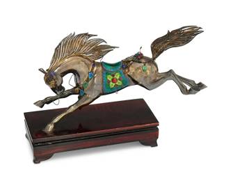 1086
20th century
A Chinese Silver And Enamel Horse Sculpture
Marked: Silver / 33
The silver horse with cloisonné enamel details and mounted to a wood base

Overall: 8.5" H x 11.75" W x 3.625" D
20.36 gross oz. troy approximately
Estimate: $700 - $1,000
