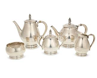 1090
Mid-20th century
An International Silver "Royal Danish" Sterling Tea And Coffee Service
Each marked: Royal Danish USA / C353 / International Sterling
The set designed in 1940, comprising 1 coffee pot, 1 tea pot, 1 lidded sugar, 1 creamer, and 1 waste bowl, 5 pieces

Largest: 8.875" H x 9" W x 5" D; smallest: 2.75" H x 4.5" Dia.
86.87 gross oz. troy approximately
Estimate: $1,000 - $1,500