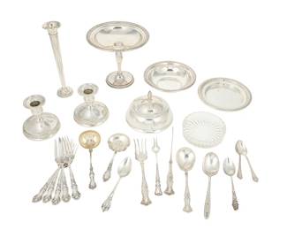 1091
Early/mid-20th century
A Group Of Assorted Silver Items
Weighted items, butter tray, and bowl marked for International Sterling "Prelude" pattern; other items with various maker's marks including Rogers Bros. and American Silver Co.
Comprising two weighted candle holders, a weighted bud vase, a lidded butter tray, a shallow bowl, and various sterling silver and silver-plate flatware items, sold together with a glass ash tray, 23 pieces

Compote: 6" H x 6.75" Dia.; smallest: 4.25" L
Weighable sterling: 11.08 oz. troy approximately
Estimate: $500 - $700