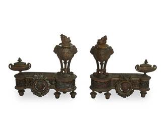 1093
Late 19th century
A Pair Of French Bronze Chenets
Each marked on the reverse: HM / 994 / 39
Each variously decorated with opposing lion masks, eternal flames, fruit and foliate motifs, and pinecone finials, 2 pieces
Each: 15.5" H x 15.25" W x 5" D
Estimate: $600 - $800