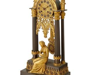 1092
Mid-19th century
A French Gothic Revival Bronze Portico Clock
With a chased gilt-bronze dial, black Roman numeral hour markers, and two train movement set in a patinated and gilt-bronze Gothic-style architectural case with pointed arches, tracery, and columns centering seated figure
20.25" H x 9.25" W x 5.25" D
Estimate: $800 - $1,200