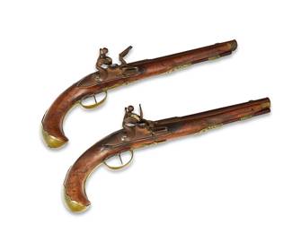 1101
Late 18th century
A Matched Pair Of Italian Lazaro Lazarino Holster Pistols
Each with an incised maker's mark on top of the breech: Lazaro Lazarino
Made by Lazaro Lazarino of the Cominazzo Family from Brescia, Italy, each matched flintlock pistol with a carved solid walnut stock inlaid with scrolling brass accents, supporting a 9.25" octagonal breech and round barrel, and terminating in a scrolling flat brass pommel retained by a screw, 2 pieces
Each: 15.25" L x 6" W x 2.5" D approximately
Estimate: $1,000 - $2,000