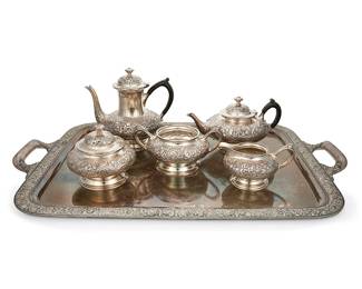 1107
Early 20th century
A Tiffany And Co. Silver-Plated Coffee And Tea Service
Each marked: 6346 / Tiffany & Co. Makers / Silver-soldered; tray alternately marked: 5264
Each with all-over repoussé floral motif, comprising 1 three-pint wood-handled coffee pot (8.325" H x 9.25" W x 6.25" D), 1 two-pint wood-handled tea pot (5.5" H x 10" W x 6.625" D), 1 lidded sugar bowl (5.25" H x 5.875" Dia.), 1 creamer (3.75" H x 6.5"W x 4.75" D), 1 waste bowl (4" H x 8.325" W x 6" D), and 1 opposed-handled serving tray (1.5" H x 30.75" W x 19.875" D), personalized, 6 pieces
Estimate: $800 - $1,200