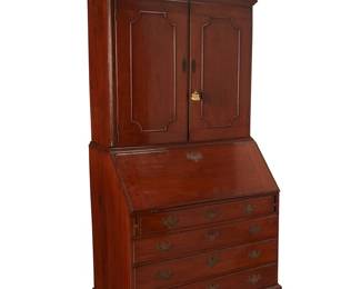 1109
Late 19th century
A Queen Anne-Style Fall-Front Secretary
The tall wood secretary comprising an upper locking cabinet case revealing eighteen cubbies and surmounted by a swan neck broken pediment centering an urn and spiral finial, and a lower drop-front case revealing five shelves and thirteen drawers, all above four drawers with batwing escutcheons and raised on carved wood bracket feet, brass hardware,
90" H x 39.75" W x 21.5" D
Estimate: $1,000 - $1,500