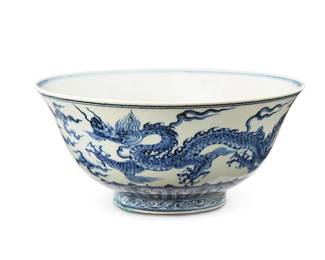1113
20th century
A Chinese Blue And White Porcelain Dragon Bowl
Marked to the underside in blue underglaze bearing an apocryphal reign mark for Xuande Period (1426-1435)
Decorated in blue underglaze with dragon and cloud motifs encircling the high exterior walls and centered on the interior well on a white glazed ground
3.75" H x 8.25" Dia.
Estimate: $500 - $700